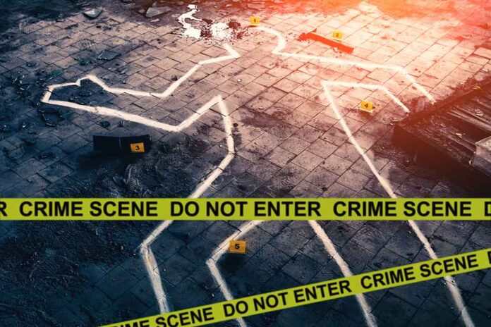 Crime scene with chalk outline and evidence markers.