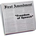 Newspaper headline about the First Amendment and freedom.