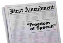 Newspaper headline about the First Amendment and freedom.