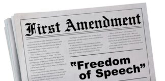 Newspaper headline about the First Amendment and freedom.