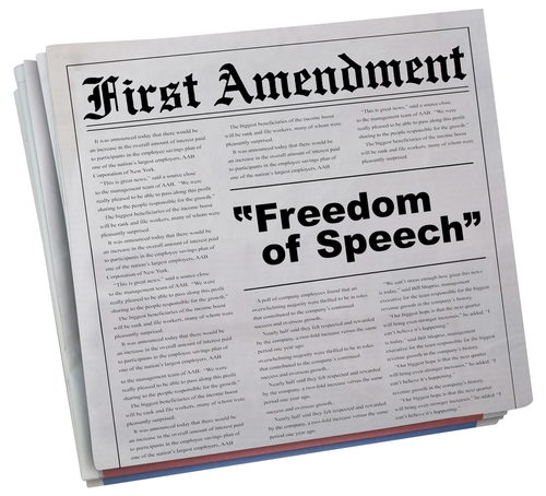 Newspaper headline about the First Amendment and freedom.