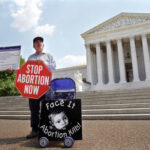 Person protesting abortion outside the United States Supreme Court.