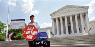 Person protesting abortion outside the United States Supreme Court.