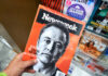 Person holding Newsweek magazine with Elon Musk cover.