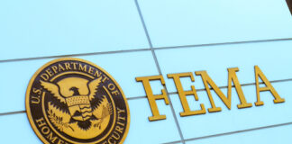 FEMA sign on building with Homeland Security seal.