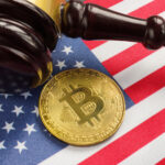 Gavel and Bitcoin on American flag background.