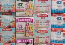 Boxes of Smirnoff Ice variety packs stacked.