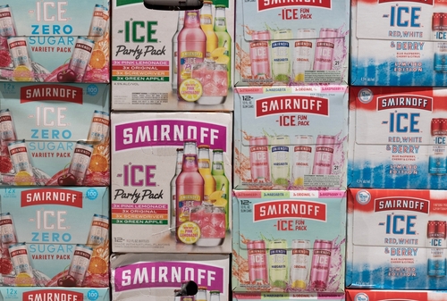 Boxes of Smirnoff Ice variety packs stacked.