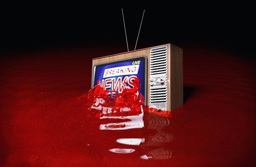 Vintage TV displaying Breaking News submerged in red liquid