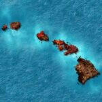 Aerial view of the Hawaiian Islands in blue ocean.