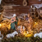 Nativity scene with Mary, Joseph, baby Jesus, and animals.