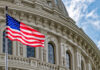 U.S. flag in front of the Capitol building.