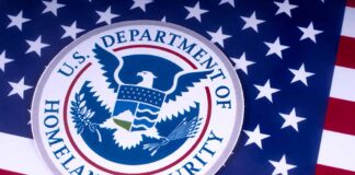 US Homeland Security emblem over American flag