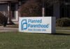 Planned Parenthood sign outside building.