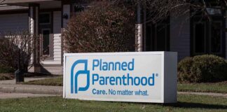 Planned Parenthood sign outside building.