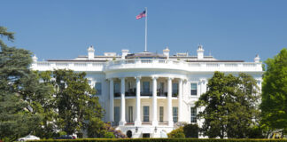 The White House with the American flag above it.