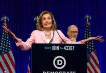 Nancy Pelosi speaking at Democratic National Committee event.