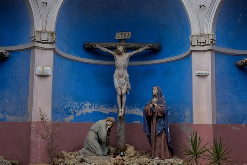 Crucifixion scene with Jesus, Mary, and another figure.