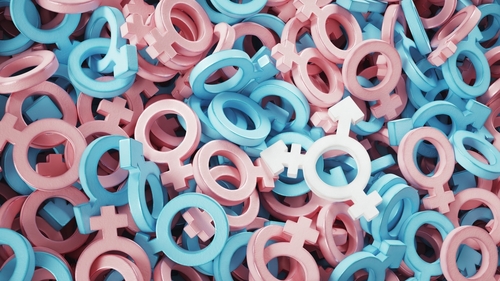 Pink and blue gender symbols scattered together.