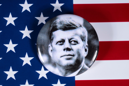 Button with John F. Kennedy on American flag background.