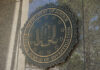 FBI seal on a building exterior wall.