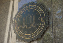 FBI seal on a building exterior wall.