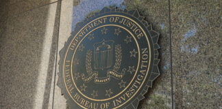 FBI seal on a building exterior wall.