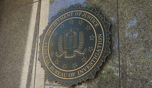 FBI seal on a building exterior wall.