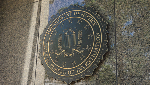 FBI seal on a building exterior wall.