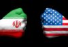 Fists painted with Iran and U.S. flags.