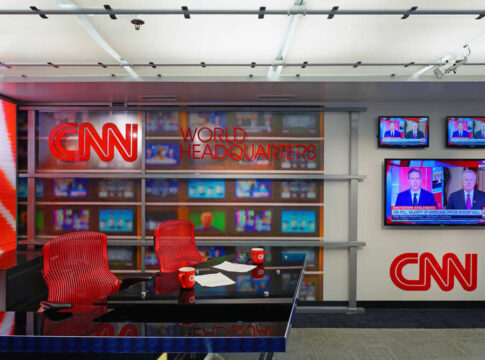 CNN World Headquarters studio with empty red chairs.