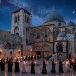 Christians BARRED From Holiest Site — Unprecedented… A group of people holding candles in a historic courtyard under a starry sky