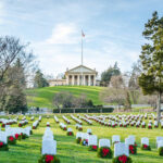 Radioactive Grave SHOCKER: Arlington Cemetery’s Hidden Hazard… Cemetery with rows of tombstones and wreaths.