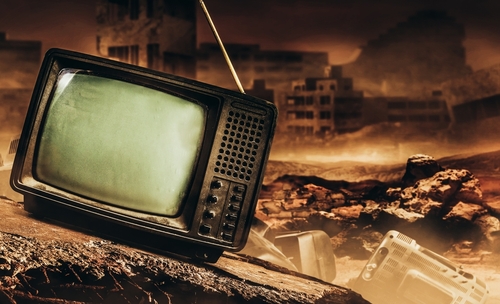 shutterstock_2143335057.jpg An old, broken television set in a desolate, post-apocalyptic landscape