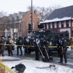 Police BearCat CRUSHES Suspect — Outrage Erupts… Police officers at a crime scene with a tactical vehicle in a snowy urban area
