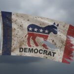 A weathered flag featuring the Democratic Party symbol and the word 'DEMOCRAT'