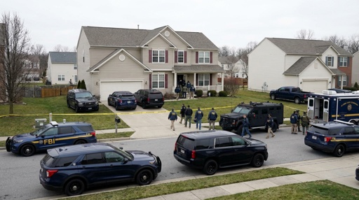 FBI agents conducting an operation in a suburban neighborhood