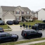 Brennan Probe CHAOS – DOJ’s Surprising Moves FBI agents conducting an operation in a suburban neighborhood