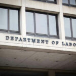 DOL Threat: Funds Cut Over Fraud Building facade with DEPARTMENT OF LABOR signage