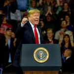 speaker at podium addressing a crowd