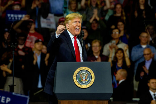 shutterstock1204270459jpg speaker at podium addressing a crowd
