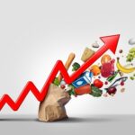 Inflation Alarm Blares Again An upward arrow made of various food items emerging from a paper bag