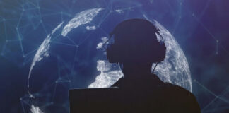Silhouette of person with headphones in front of globe.
