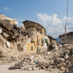 Israel Breaks the Ceasefire Silence — Beirut Gets Hit Rubble from collapsed buildings in earthquake-hit area. Clear sky.