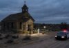 FBI Image Drops—No Suspect Named Police and forensic team at a crime scene near an abandoned church in the desert