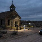 FBI Image Drops—No Suspect Named Police and forensic team at a crime scene near an abandoned church in the desert