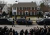 FBI agents and SWAT team outside a house during an operation