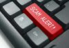 How Agents Took Aim at Illegal SIM Farms Keyboard with red scam alert key