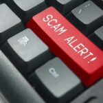 How Agents Took Aim at Illegal SIM Farms Keyboard with red scam alert key