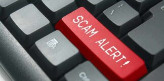 Keyboard with red scam alert key